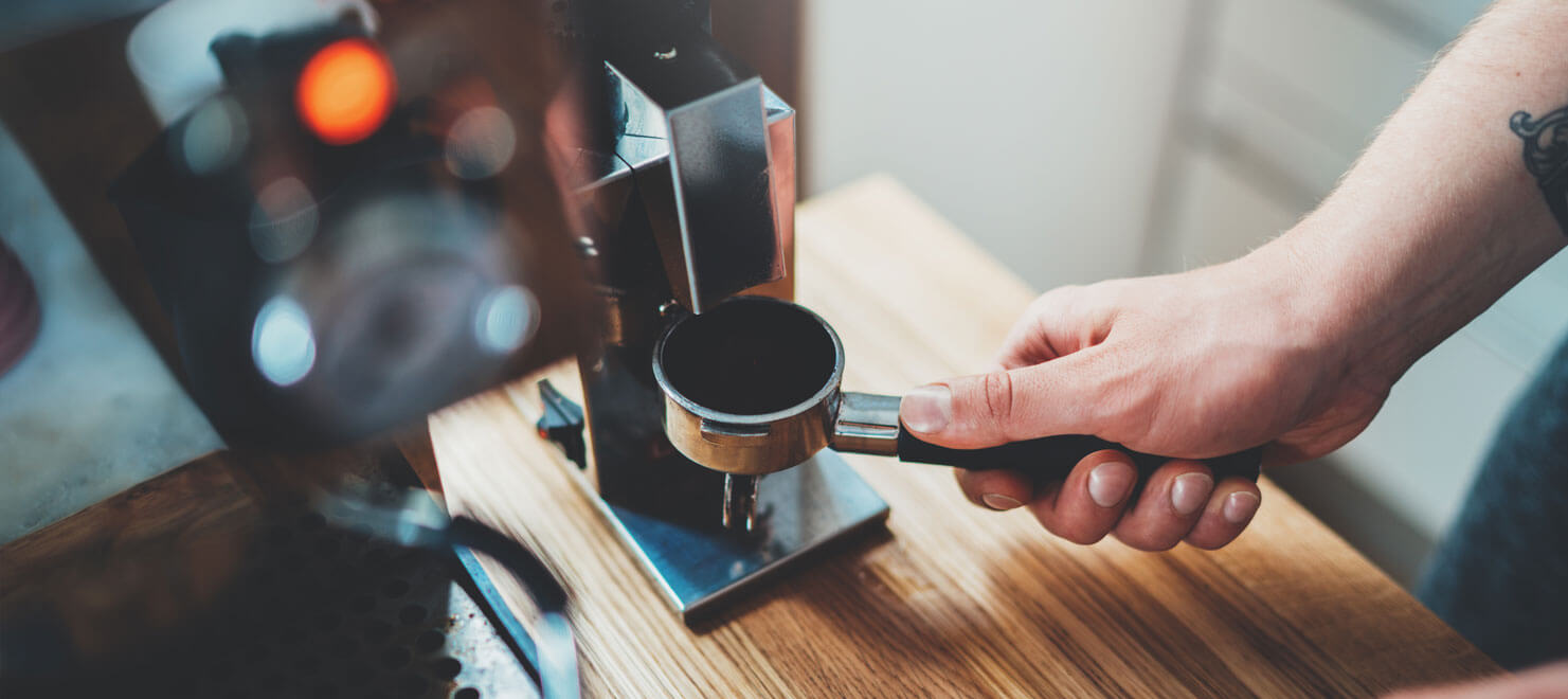 hand using espresso machine