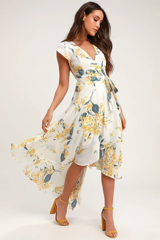 woman wearing a long white and yellow floral print dress