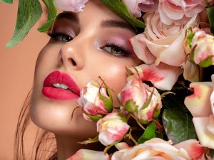 woman with thew smell of roses for valentines day 2023
