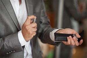 a man applies a woman's favorite cologne 